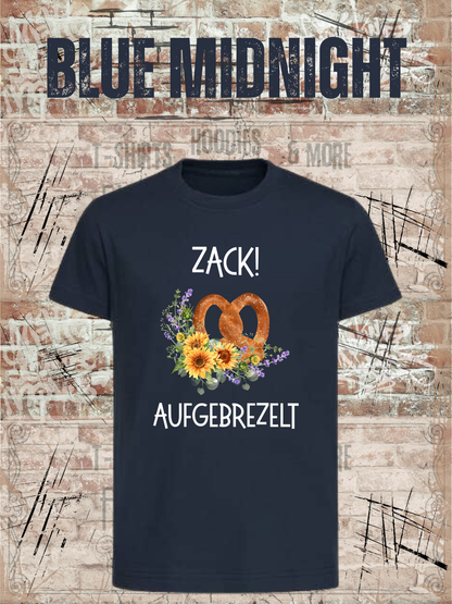 Kinder-T-Shirt „Zack! Aufgebrezelt“ in Blue Midnight.