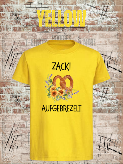Kinder-T-Shirt „Zack! Aufgebrezelt“ in Yellow.