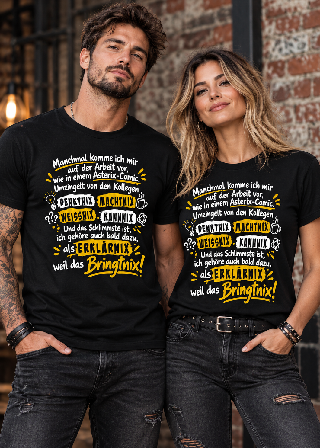 Mann und Frau in schwarzen Unisex-T-Shirts (Black Opal) mit weiß-gelbem Büro-Spruch „Wie in einem Asterix-Comic“.
